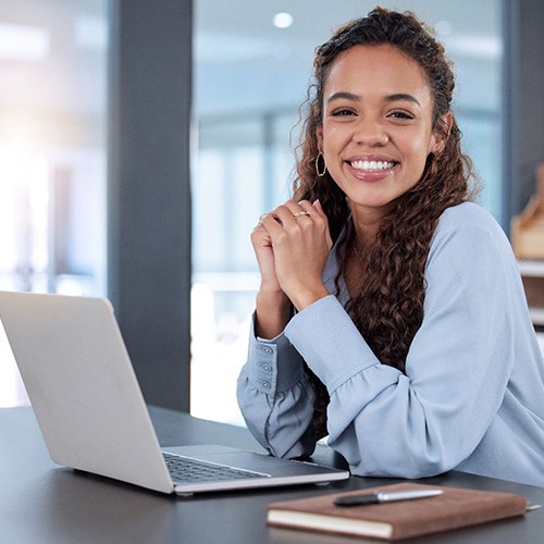 Woman smiling while working in office