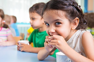 Closeup of child eating snack at school